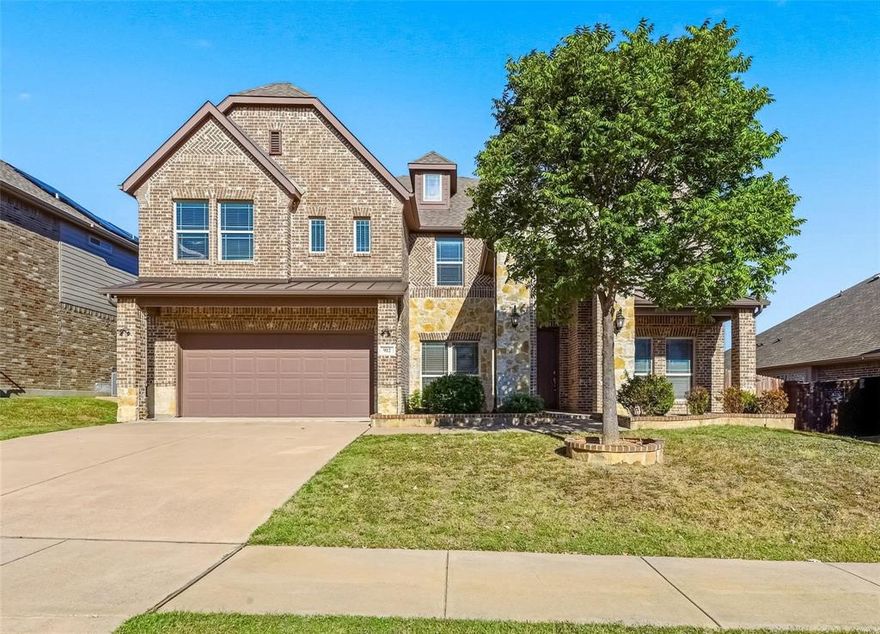 Step into this spacious sun filled 5 bedroom 3.5 bath home located in Mansfield ISD, designed for effortless living. Morning coffee by the window, and weekends made for gatherings. This Stunning 2 story house boasts an open concept design with espresso color laminate flooring,and carpeting throughout. As you enter the property you are greeted with an extended foyer passing the formal living and dining area. The kitchen features stainless steel appliances, butlers pantry off the kitchen, gas cooktop, granite countertops, built-in microwave, dishwasher and plenty of cabinetry. Leading to the spacious living area with a stone electric fireplace overseen by a lovely curved staircase with iron spindles. The spacious primary bedroom is conveniently located on the first floor and features a garden tub, separate shower, double vanities, and a walk-in closet. All spacious secondary bedrooms,tertiary living and 2 full baths are located on the second floor along with a Theatre-style media room with surround sound prewire. Backyard has a large covered patio. You do not want to miss out on this amazing home!