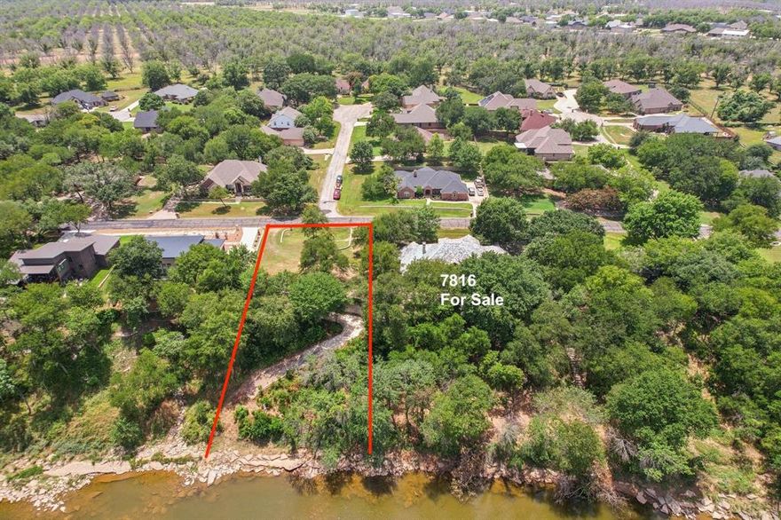 Amazing Riverfront Home Site in the master planned community of Pecan Plantation! Plenty of space at 0.44 acres to build your future home. One of the last buildable river front lots in the neighborhood. Back of the lot has a concrete pathway down to the river which makes it easy to launch small water craft.  Executive Home and land is also for sale next door MLS 20803816. This home site is a Must See!