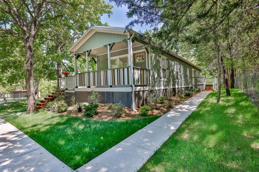 This property is the definition of “loved.” Every inch of this 8.363-acre spread has been groomed, maintained, and improved with care and craftsmanship. The 2019-built 900 sq. ft. home feels nothing like a typical manufactured home—custom molding and thoughtful upgrades by a builder gives it a true residential finish. A charming covered front porch sets the tone, while the side porch off the back door overlooks peaceful wooded acreage, where deer visit almost every morning. The land is beautifully landscaped and fully pipe-fenced with no-climb wire, perfect for horses, cows, or any animals you want to bring. A 24x50 4-carport with electricity and loft for storage.  12x24 storage building, 220 amp, workbench, outside lights. (2) 10x20 loaf shed, (1) 10x16 outbuilding and a storm shelter provide exceptional utility. Includes a 0.9480-acre corner lot along busy Hwy 377, the property also carries strong commercial possibilities.  This property offers far more than can be listed here. Be sure to review the MLS Additional Information for the full upgrade list, and ask your REALTOR® for all the details.    MUST-SEE  Buyer Approval before showing.