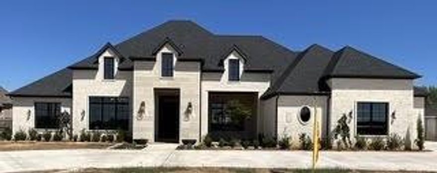 ARGYLE SCHOOLS - DENTON TAXES.  It doesn't get better than a Carmen custom home!  Energy efficient, with too many designer touches throughout.  The amazing game room opens up to the back patio via 16' sliding glass doors for more entertaining space.  Outdoor kitchen and prep areas mean the party will always be at your house!  This one is just getting started - but color choices and designer lighting is shown in pictures.