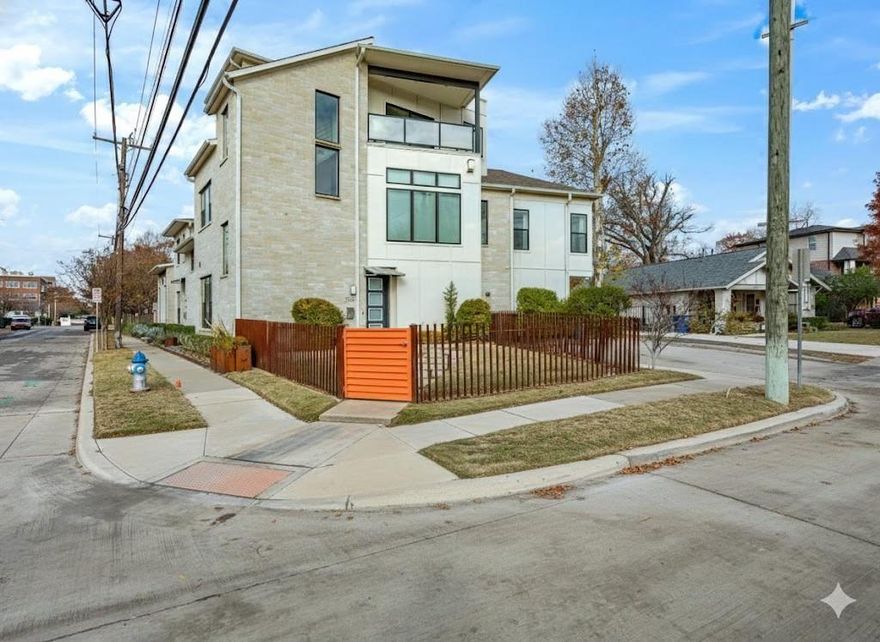Modern design meets unbeatable location in this striking three-story residence nestled just moments from the vibrant Knox-Henderson corridor and Lower Greenville. With quick access to Uptown, Downtown, Deep Ellum, and White Rock Lake, this home is ideally positioned to enjoy the best of Dallas living—nearby dining, entertainment, trails, and nightlife.

The curb appeal is undeniable, with sleek architectural lines, neutral tones, and a gated front yard. Inside, you'll find over 2,500 square feet of well-designed space with clean lines, tall ceilings, and large windows throughout. The first floor offers a versatile guest suite or secondary owner’s suite, complete with ensuite bath, walk-in closet, and direct access to the two-car garage and laundry.

Upstairs, the heart of the home features an open-concept layout filled with natural light. The gourmet kitchen boasts expansive quartz countertops, a 6-burner gas range with stainless steel vent hood, custom cabinetry, and generous storage. It opens to a spacious dining area and living room anchored by a stone fireplace and oversized windows that frame treetop views. The main owner's suite is also on this floor, offering polished concrete floors, a spa-like bath with dual vanities, a walk-in shower, and a custom closet system. On the third level, enjoy a second living area perfect for media, fitness, or a home office, along with a third private bedroom and bath. Step outside onto the covered balcony—ideal for relaxing or entertaining with city views and seasonal color. Additional highlights include light-toned hardwoods, recessed lighting, sleek finishes, and a neutral palette ready for your personal touch. A rare find in one of Dallas’ most sought-after neighborhoods!
