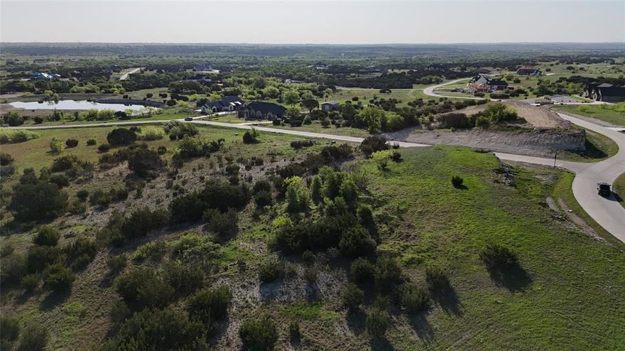 Stunning Hilltop Lot with Panoramic Views in Gated Community – Cresson, TX
This exceptional 2+ acre lot offers breathtaking 360° views and a prime build site that perfectly captures the scenic beauty of the area. Overlooking the community pond and park, this property provides a serene and elevated setting for your future estate dream home.
Located in the prestigious Putteet Hill, a private gated community featuring concrete streets, underground utilities, and high-speed fiber internet, this neighborhood is home to custom residences ranging from $900K to $2.5M.
Nestled within the City of Cresson, you'll enjoy one of the lowest property tax rates in the region—just 1.26%. For example, a $1M home pays approx. $12,600 a year in taxes—half or less compared to neighboring communities, where similar homes may incur $24K–$33K a year.
Ideal Location:
? 5 miles to H-E-B & Kroger in Granbury
? 18 miles to I-20 in Fort Worth
? Easy access to shopping, dining & major highways
Whether you're planning your forever home or investing in land in a rapidly appreciating area, this property delivers exceptional value, stunning views, and unbeatable tax advantages.