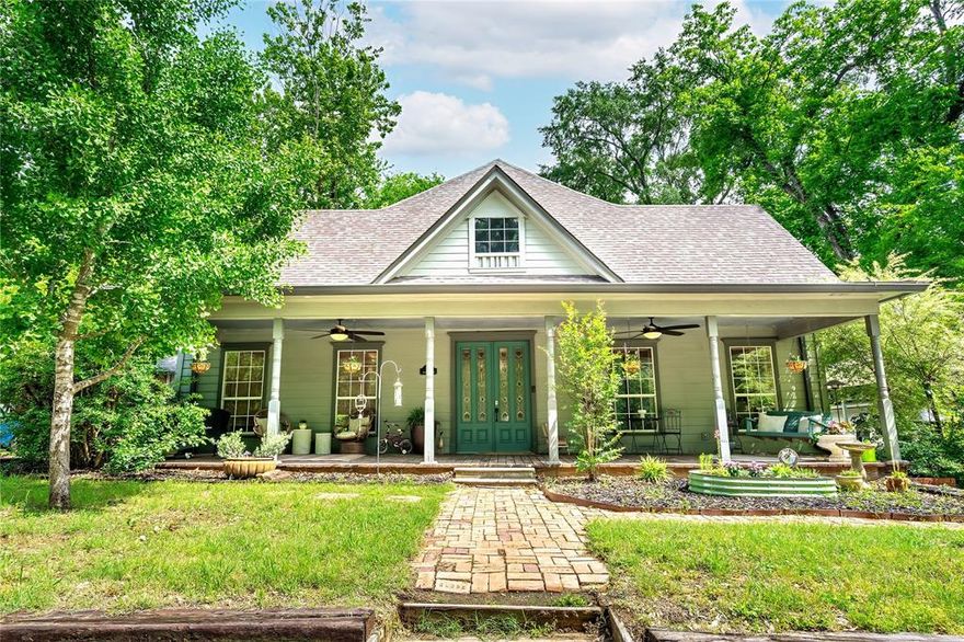 Beautifully updated country charmer Craftsman style historical home built in 1900 but fully renovated over the past several years is in perfect move-in ready condition. Huge front porch is just right for early morning coffee or late afternoon sweet tea. Inside you'll notice all the original hardwood floors and the eight-foot tall glass French doors and twelve-foot ceilings. Large family room is completely open to the fully updated kitchen with new quartz countertops, fresh painted cabinetry, new backsplash and stainless appliances including a gas cooktop. Large primary suite has a wonderful primary bathroom with extra-large walk-in shower and walk-in closet. Towards the back half of the home you have two more generously sized bedrooms which share a full bathroom. And at the back of the home is a landing area which makes a great work-from-home office as well as a large utility room and a separate reading nook! Outside you'll note two driveways--one is paved and the other is gravel with an RV outlet and carport cover--perfect for your visiting guests in their RV! Outback you'll find a nice size yard, large shed or outbuilding and a fully operational chicken coop. This home faces wonderful greenery across the street and is just down the street from the library and downtown area including the historic movie theatre. And just to the other direction a short distance are farms and plenty of horses. Own a piece of East Texas history that has all the charm and character you could ever imagine. Home has two zones for heat and air and the roof is just over one year old!