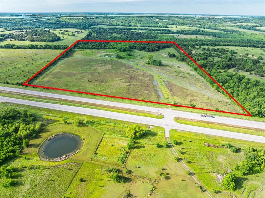 Discover a rare investment opportunity with this 34+ acre parcel of prime real estate located directly on Highway 82, just east of Bonham, Texas. Boasting over 1,700 feet of highway frontage, this property offers exceptional visibility and access, making it ideal for future commercial development.

Currently zoned agricultural, the land is open and versatile, featuring a beautiful mix of level pastureland framed by a mature tree line along the back, east, and west boundaries—adding both natural privacy and aesthetic appeal. 24 inch water well already in place! The property is partially fenced, with water and electricity conveniently available at the road, streamlining future development or agricultural use.

Situated just minutes from the rapidly developing Bois d’Arc Lake and in the heart of booming Fannin County, this parcel is positioned perfectly for investors, developers, or those looking to build in a growing area. With high traffic exposure and proximity to major regional destinations, this tract holds significant long-term potential.

Whether you’re looking to build, invest, or expand into one of North Texas’ most exciting growth corridors, this property offers the perfect blend of location, accessibility, and opportunity.
