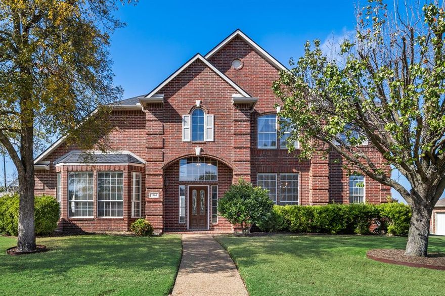 Welcome home to 104 Cambridge Court located in the desirable Wellington Ridge Manor subdivision. This 4-bed, 3-bath home offers a functional layout with an open and inviting feel. The main living area features hardwood floors and a gas log fireplace. The kitchen showcases newly installed white veined granite countertops, tile backsplash, stainless steel farmhouse skink, generous cabinetry, walk-in pantry, and a bright breakfast area. The primary suite on the first floor has beautiful large bay windows allowing for an abundance of natural light.  The generously sized ensuite bath with recently updated countertops includes a shower and garden tub adjacent to a walk-in closet with custom closet system. A dedicated study with direct access to a full bath can serve as a private guest room. Upstairs, three additional bedrooms and a full bath are situated off a spacious game room — perfect for family or guests. The large side and back yards provide ample space for entertaining, gardening, or play. Only minutes from Lake Ray Hubbard, area shopping and dining, and area schools, you won't want to miss your chance to own this well-appointed home in a prime Heath location.