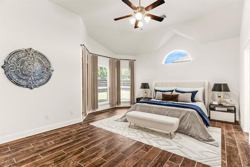 Stunning single-story home built in 2018 by First Texas Homes with a customized Sonoma floorplan in the desirable Willow Wood community of McKinney, zoned to award-winning Melissa ISD. This 4-bedroom, 2-bath, 2,508 sq ft home features 11-foot vaulted ceilings, architectural archways, upgraded lighting, and wood-look tile flooring throughout the home. A private home office with glass-pane French doors sits at the front of the home, ideal for work or study. The gourmet kitchen includes quartz countertops, subway tile backsplash, walnut cabinetry with pot drawers, a large island with storage, walk-in pantry, and separate butler’s pantry with glass-front uppers. Frigidaire Gallery stainless appliances include double oven, gas cooktop, and vent hood. The kitchen opens to a spacious living room with natural light and a stone gas fireplace with wood mantel and TV wiring. The oversized primary suite offers vaulted ceiling with crown molding, bay windows, and a spa-like bath with dual vanities, soaking tub nook, walk-in shower with body sprays, private water closet, and large walk-in closet with built-ins. Secondary bedrooms include vaulted ceilings, generous closets, and easy-care tile flooring. Smart home upgrades include Ecobee thermostat, ethernet to every room, HomePro security system, central vacuum, industrial-grade water filtration and softener system, tankless water heater, Wi-Fi booster, and exterior porch camera. Backyard features a covered patio with aviator fan, roller shade, and storage shed that conveys. Oversized 2-car garage offers ceiling storage racks and side entry door. Willow Wood offers a resort-style pool with splash park, basketball court, playground, walking trails, and quick access to Hwy 5, US-75, and 121. Less than a mile from Willow Wood Elementary and minutes from downtown McKinney, retail, dining, and parks.