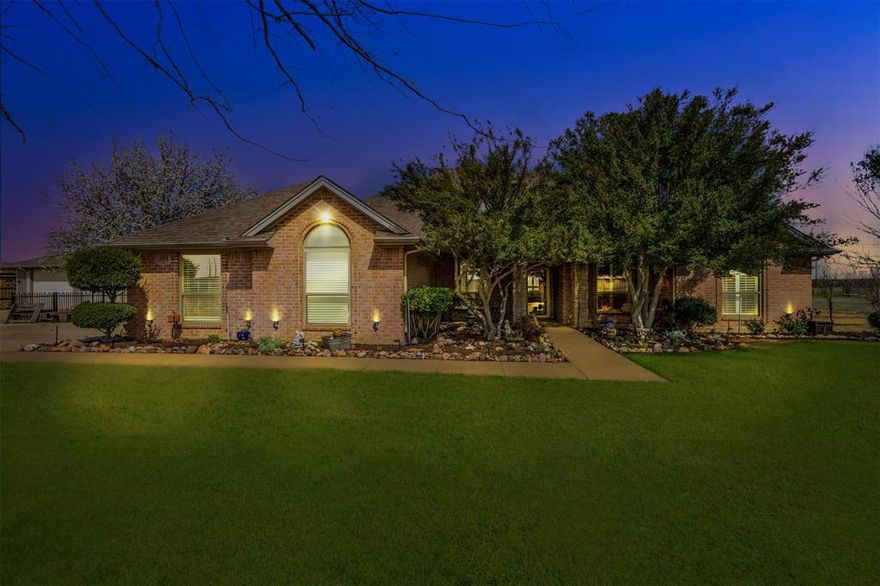 Welcome to your private retreat in the heart of Haslet!
Set on just over 6 peaceful acres across from Eaton High School in Northwest ISD, this 4-bedroom, 2-bath home combines privacy, comfort, and versatility—all just minutes from city conveniences.

A gated entrance and long private drive lead to a circle drive and welcoming covered porch. Inside, you’ll find a warm, functional layout featuring a cozy living room with a fireplace and built-ins. The kitchen offers granite counters, tile backsplash, stainless steel appliances, and ample storage—perfect for everyday living.

The split-bedroom layout provides space for everyone, and the primary suite includes dual vanities, a soaking tub, separate shower, and walk-in closet. The HVAC system was replaced in 2025, giving peace of mind for years to come.

Out back, the 36x45 heated and cooled shop features its own electric meter, built-in cabinets, and a covered trailer porch ideal for parking extra vehicles or equipment. The attached garage is equally impressive with epoxy floors, an attic lift, and a separate office space perfect for working from home or managing projects.

With a hail-resistant roof, private well, and aerobic septic system, this Haslet gem offers the perfect blend of functionality and Texas charm—all on 6 acres in the sought-after Northwest ISD.