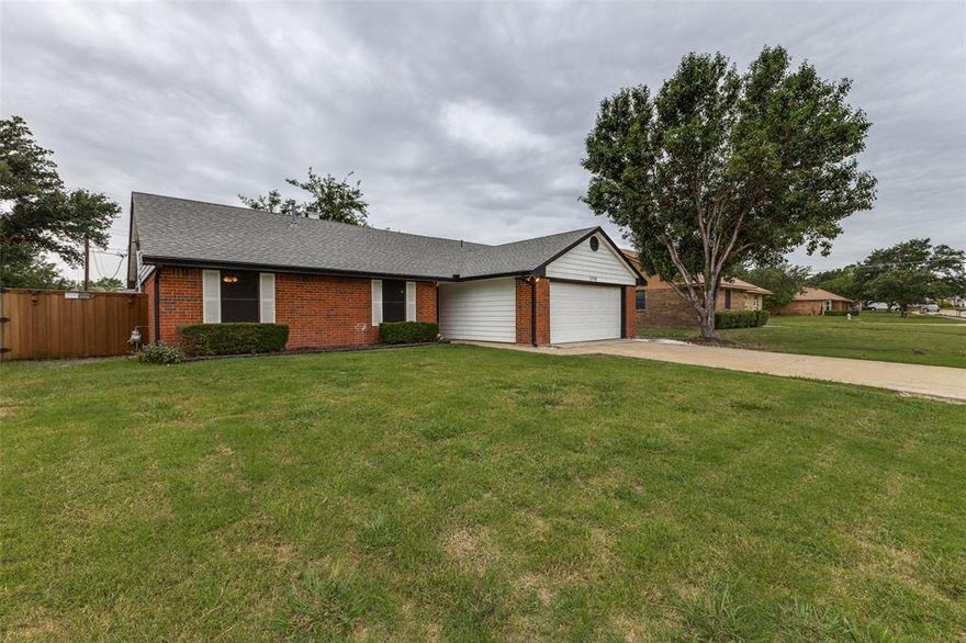 MOVE-IN READY with major updates already done, giving you peace from day one! Freshly painted interior - June 2025! Brand New Condenser unit and Evaporator coil - July 2024. Hot water heater - Oct 2024. New 150 amp main breaker- May 2024, New Furnace - 2021.  No carpet throughout the home means easy maintenance, with engineered wood flooring in main areas and ceramic tile in wet spaces. Step inside to a spacious entry that leads to a large living room featuring vaulted ceilings and a cozy brick fireplace — the perfect gathering spot. The kitchen is updated with NEW stainless steel Whirlpool Appliances, including a range with convection and built-in air fryer — ideal for the modern cook. Enjoy a huge backyard with a privacy fence, great for kids, pets, or entertaining. Located in the heart of Sachse, you’ll be near all school levels (Sewell or Armstrong Elementary, Hudson Middle, and Sachse High) and within walking distance to Salmon Park, Park Lake Park, Cornwall Lane Park, the Library, and city amenities.