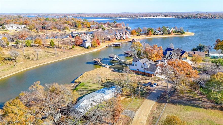 Waterfront opportunity on approximately half an acre with 150 feet of shoreline and 112 feet of road frontage, ideally positioned in a recently dredged cove with quick access to open water. Surrounded by upscale designer homes and newly constructed million-dollar properties, this location offers both privacy and long-term upside with convenient access to major highways.

The main residence is a 2011 manufactured home offering approximately 945 square feet with three bedrooms and two and a half baths. The home is fully covered with a detached tin roof and features upper and lower skirting with tie-downs. Recent updates include new HVAC and hot water heater, along with interior renovations such as flooring, paint, and fixtures. Enjoy outdoor living with approximately 40 feet of covered decking complete with an outdoor sink, cabinets, and an enclosed TV area.

The property also includes a separate approximately 600 square foot guest house or private suite featuring one bedroom, one bath, tile flooring, a full kitchen with stainless steel appliances, and a full-size laundry room—ideal for guests, extended family, or additional flexibility.

Additional improvements include a workshop with electricity and a dedicated dog run, adding both functionality and convenience. Located in the Malakoff ISD, this waterfront property offers a rare combination of lake access, multiple living spaces, and an exceptional setting. Can also be sold as lot value only with buildings removed. Contact Listing Agent for more information.