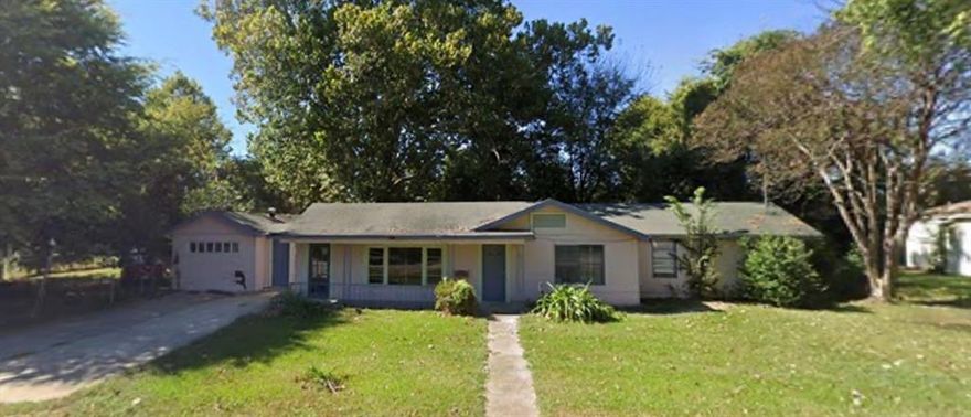 Full of history and charm, this 1940's home is backdropped by gorgeous established trees and features French doors, faux fireplace and a spacious floorpan.