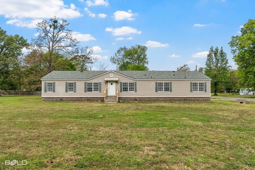 SPACE, PEACEFUL LIVING, AND ROOM TO BREATHE, Welcome to this beautifully updated 5-bedroom, 3 full bath home sitting on more than half an acre with an expansive front, back, and side yard, in a corner lot, a rare find in South Shreveport! Step inside and you’ll immediately notice the natural light pouring through the windows, highlighting the beautiful light fixtures and spacious layout designed for everyday living and entertaining. The chef’s dream kitchen is truly the heart of the home, featuring abundant cabinetry, a pantry, a wing island perfect for breakfast, and plenty of room to gather with friends and family. Plus, the home includes a new refrigerator and newer stove and dishwasher, making it move-in ready.  The updated bathrooms and improvements throughout the home add a fresh, modern feel, while the new brick skirting surrounding the home enhances both durability and curb appeal. The primary suite is a retreat of its own, offering a private study room, a beautiful bathroom with a relaxing tub, and a huge master closet that provides exceptional storage. You’ll love the fully fenced backyard, perfect for pets, outdoor gatherings, gardening, or simply enjoying the peaceful surroundings. Homes with this much land and usable yard space are becoming harder to find. Roof approximately 3 years old, not in a flood zone, plenty of outdoor space for entertaining, location is incredibly convenient, just minutes from: Shopping centers and grocery stores, Restaurants and coffee spots, medical facilities and major services, Schools and parks, Easy access to main roads for commuting across Shreveport and Bossier. Large mobile homes like this are highly desirable because they provide: More living space than many traditional homes in this price range.  Homes with this much space, updates, and land in this area do not stay on the market long. This isn’t just a home… it’s where your next chapter begins. Don’t miss the opportunity to make it yours.