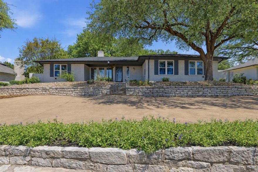 Stunning curb appeal and perfectly situated on the 8th hole of Pecan Plantation Golf Course, this beautifully updated 3-bedroom, 2.5-bath home blends modern upgrades with timeless character. The spacious open-concept floor plan features a wood-burning fireplace and expansive windows that showcase picturesque golf course views. The updated kitchen boasts modern finishes, a large island, and ample space for entertaining. A convenient half bath is ideal for guests. Enjoy year-round relaxation in the sunroom, overlooking a shaded backyard deck—perfect for outdoor living. A dedicated workspace adds flexibility for remote work or hobbies. The primary suite is generously sized and features a fully updated ensuite bath with a walk-in shower and walk-in closet. Secondary bedrooms are also well-sized with ample storage and access to a full bathroom. A three-car garage provides plenty of room for vehicles, storage, and a golf cart. Located in the highly sought-after gated community of Pecan Plantation, residents enjoy resort-style amenities including two championship golf courses, clubhouses with dining, a marina on the Brazos River, riverfront parks, pools, tennis and pickleball courts, fitness facilities, and walking trails. Additional features include a private airpark, equestrian facilities, and convenient on-site services such as a grocery store, pharmacy, bank, and medical offices. With 24-hour security, private EMS and fire services, and an active community lifestyle, Pecan Plantation offers an exceptional place to call home.