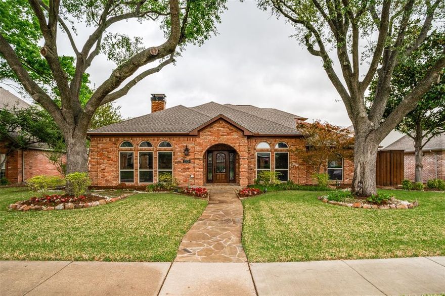 Over $100K invested in just the last three years! Professionally landscaped drive-up, mature trees, plantation shutters, wrought iron balusters, updated windows, flooring, painting, tankless water heater, new carpeting, oh my! Double-sided gas log fireplace connecting the front living room and family room. The front living area includes a stacked stone accent wall, while the family room offers a custom entertainment center with rich wood wainscoting — ideal for everyday living and entertaining alike — and both flat screen TVs stay!

The gourmet kitchen has white cabinetry, granite countertops, stainless appliances with built-in double oven, gas cooktop, and decorative range hood, plus a large center island and dedicated coffee bar with arabesque tile backsplash and rustic floating shelves. Walk in pantry with built-ins!

The downstairs owner's suite features a spa-inspired bathroom with vaulted ceilings, freestanding soaking tub, oversized marble walk-in shower, dual granite vanities, and crystal chandelier. A generous walk-in closet includes custom built-in shelving and drawers. Bedroom two offers a built-in Murphy bed system with flanking bookshelves — perfect as a guest room or home office. Both secondary bathrooms have been completely updated with granite vanities, tile showers, and designer finishes.

Step outside to a true backyard paradise. The upscale covered patio features a stained cedar ceiling, ambient pendant lighting, outdoor TV, stacked stone accent wall, and its own dedicated mini-split heating and cooling unit for year-round comfort. The in-ground heated swimming pool includes a new filter, pump, heating system for near year-round swimming, and Wi-Fi-enabled controls — all backed by an 8-foot board-on-board privacy fence. Two brand new HVAC systems and a new roof with fascia (2023) round out a home where virtually every major system has been replaced!