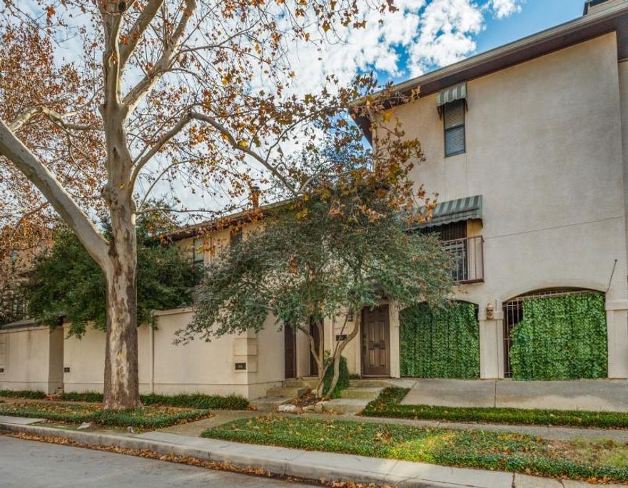 Prime location near Highland Park and the Katy Trail sets the stage for this move-in ready 3-story corner-unit condo with open spaces, dual balconies in dining and living areas and a cozy fireplace creating an inviting atmosphere, complete with a wet bar. The galley kitchen with garden window, and built-in wine storage enhances functionality and style. Two spacious upstairs bedrooms with walk-in closets provide comfort and privacy. In-unit laundry, reserved garage parking, and low HOA dues make this residence a rare opportunity to enjoy sophisticated, low-maintenance living, close to the city’s premier shopping and dining.