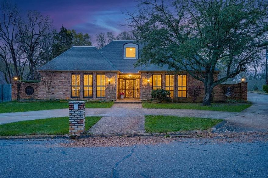 Timeless French Country architecture meets resort-style living in this exceptional home perfectly situated on a spacious .50-acre cul-de-sac lot that feels private and secluded while still being conveniently located in the heart of Paris.

A charming gated courtyard entry creates a welcoming first impression and leads into a gracious foyer featuring elegant parquet flooring, setting the tone for the character and craftsmanship found throughout the home. Chandeliers throughout add warmth and sophistication while complementing the home’s classic architectural style.

This thoughtfully designed 4-bedroom, 4.5-bath residence offers generous living spaces ideal for both everyday living and entertaining. The grand living room features custom built-ins and a beautiful fireplace, creating a warm and inviting gathering space. Just beyond, a light-filled sunroom overlooks the backyard oasis, where a sparkling saltwater pool provides the perfect place to relax and unwind.

The chef’s kitchen is equipped with a gas cooktop, double ovens, granite countertops, abundant custom cabinetry, and a versatile flex space with water connections ideal for a wine bar, coffee station, or additional prep area.

The primary suite offers a private retreat with dual primary bathrooms and expansive walk-in closets with custom built-ins. Guest bedrooms are arranged in a split layout, with two bedrooms offering ensuite baths, providing comfort and privacy for family or guests.

Additional highlights include a formal dining room, charming breakfast room overlooking the pool, circular drive, oversized garage, and additional parking. The backyard also offers a grassy yard area perfect for pets or play.

This one-of-a-kind property blends timeless style, space, and comfort in a truly special setting.