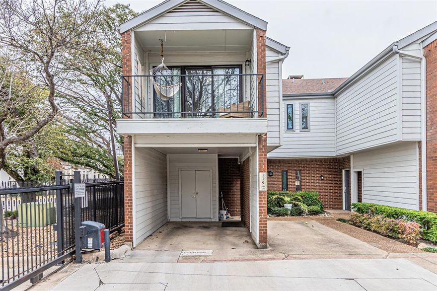 Located in a quiet, gated community near Addison, this charming two-story condo in Dallas offers both convenience and comfort. Featuring vaulted ceilings and abundant natural light, the living room also boasts a beautiful spiral staircase and a cozy wood-burning fireplace. The home has been freshly painted. The kitchen is highlighted by a blend of wood and granite countertops, along with updated light fixtures. Additional amenities include a private patio on the main level and another patio on the second floor, accessible from the primary bedroom. Ideally situated near major highways, top restaurants, and grocery stores, this condo is move-in ready and perfect for comfortable living. Additionally, this unit includes an assigned covered parking spot with a private storage space.