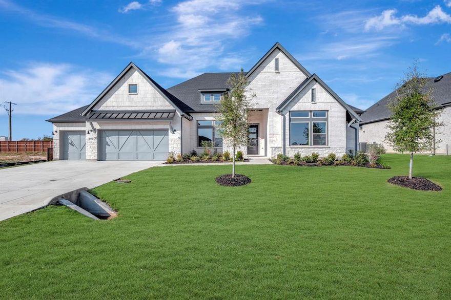 Experience spacious living and exceptional craftsmanship in The Steel by David Weekley Homes—a floor plan that makes a lasting impression from the moment you walk through the door. The dramatic entry opens to a sun-drenched family room with expansive views that stretch to the backyard, creating a welcoming flow that’s perfect for gatherings and everyday moments. The gourmet kitchen is both beautiful and functional, featuring a full-function island and chef-friendly layout that makes meal prep a breeze. Oversized energy-efficient windows and a covered back porch blur the lines between indoor comfort and outdoor relaxation, perfect for North Texas sunsets and quiet mornings by the lake. The Owner’s Retreat is a private sanctuary with a spa-inspired en suite bath and a spacious walk-in closet designed to simplify your routine. A versatile study and quiet TV room offer flexible spaces that can become a home office, library, game room, or whatever your lifestyle demands. Three additional bedrooms provide comfortable retreats for guests or family members, while the expansive 3-car garage and thoughtful family foyer bring practical convenience to busy days and homecomings. Located in the serene, lakeside community of Northshore at Lakewood Village, The Steel offers more than just a beautiful home it’s a gateway to a lifestyle enriched by nature, recreation, and community. With Lake Lewisville just moments away, you’ll enjoy access to boating, hiking, and peaceful views in a neighborhood designed for balance and well-being. Begin your #LivingWeekley journey in a home that truly delivers on space, elegance, and possibility supported by David Weekley’s industry-leading warranty and legendary customer care.