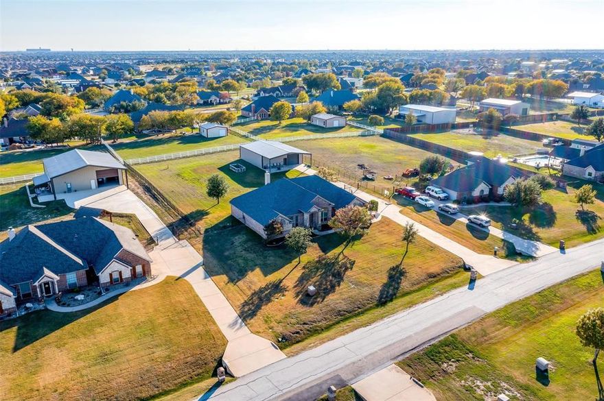 This Gorgeous Home has been Totally Remodeled with new Kitchen, Baths, Flooring, Paint, & Upgrades Galore! Located in Highly desirable Lonesome Dove Estates in Northwest Fort Worth, this Beautifully Designed Home Features top of line finishes & chef's dream kitchen with a Huge Granite Island, farmhouse sink, subway tile backsplash, white cabinetry, stainless appliances & custom cabinet built-ins for displaying your gorgeous art pieces, fine china, crystal, etc.. The Spacious 1 Story Floorplan is perfect with 4 bedrooms, a Study, and TWO Living areas! The Fully Fenced 1-acre lot includes an electric dog fence, Raised Garden with producing grapes, & a huge 50x40 Metal Shop with bathroom, front & back rollup doors, ideal for Hobbies or Business, Storing Boats, Trailers, ATVs, Home Gym, or relaxing on the expansive covered patio! RV Hookup! Ideal Location, with nearby city conveniences like new shopping, restaurants & entertainment, WITHOUT THE CITY TAXES! Truly made to be your next HOME!