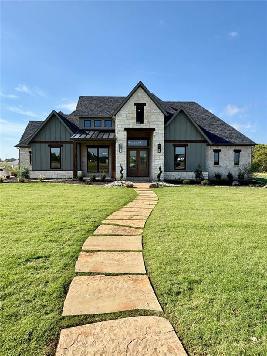 Welcome to your MOVE IN READY dream home in the highly desirable Hunters Ridge Phase 3 community, located within Gunter ISD just outside the city limits with NO HOA and NO CITY TAXES! Nestled on a sprawling 2.45 acre corner lot surrounded by mature trees, this brand new Build Paragon Construction masterpiece perfectly blends modern luxury with serene country living. This foam insulated home features 4 spacious bedrooms, each with its own bathroom, plus a flex room with an en suite upstairs that can easily serve as a fifth bedroom, game room, or home office. The thoughtfully designed open floor plan showcases vaulted ceilings, abundant natural light, and elegant finishes throughout. Every bedroom includes walk in closets for ample storage. Chef inspired kitchen featuring a Thermador Pro Harmony 48 inch gas range, hidden walk in pantry, hand crafted cabinetry for storage and generous counter space..ideal for entertaining or family gatherings. Step outside to your huge covered patio with tongue and groove pine ceiling...perfect for relaxing, dining, or hosting guests while enjoying peaceful views of your private, wooded acreage. Experience the best of luxury living with no compromises...privacy, space, and style in one remarkable property.