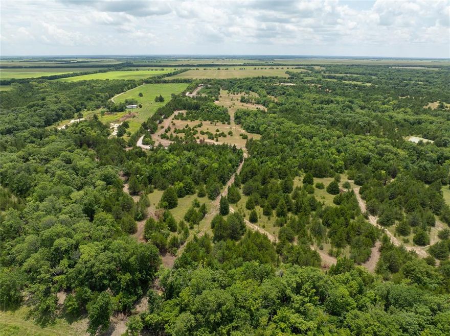 Tract #2 of 8 – Prime Country Living Near Bois d’Arc Lake – Build-Ready Lots Available! Owner Financing Available. Discover your slice of Texas paradise just 8 miles from the shores of Bois d’Arc Lake and 10 miles from the newly constructed Lake Ralph Hall. Use your current home equity to purchase this land. See agent for more info. Nestled south of Highway 82 with a Windom address, these serene parcels offer the perfect blend of nature, convenience, and opportunity. Property Highlights: - Peaceful Setting: Located at the end of a quiet, tree-lined county road with beautifully maintained surroundings - Natural Beauty: Each lot features mature native trees, walking trails, and scenic seasonal creeks; select tracts include private ponds -(Tract 2 does NOT have a pond) Ideal Topography: Flat, dry, and buildable land — ready for your dream home, cabin, or investment project - Easy Access: All parcels boast easy access on a newly built private road - Utilities Ready: Electricity is available on every lot - Water Access: water main by Bois D’Arc MUD is established - Water Update: Seller is actively funding the final line upgrade and extension to accommodate all new tracts. Whether you're seeking a peaceful retreat, a weekend getaway, or a smart land investment near Texas’s newest recreational lakes, these parcels check every box. Act now to secure your lot before prices rise with utility completion!.  Inquiries, call Listing Agent. Use for exact address:  725 County Road 2997 Windom, TX 75492