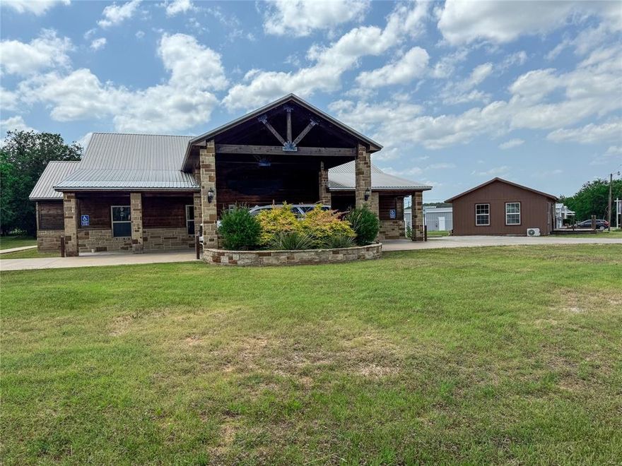 So Much Opportunity with this Property! 11 Buildings on 8 Total Acres with a Pool and Volleyball Court! All at the Main Corners of Lakeside Village at Lake Whitney. Property is Split, 2 Buildings and 1.14 acres are on the West Side of FM 56 and the other 7 acres and 9 Buildings are on the East side of FM 56. This Property was a 24 hour Rehab facility where patients lived during their recovery. It housed over 30 patients at one time. Multiple Cabin Style Bedrooms all with Bathrooms. Plenty of Offices, and Open Meeting Rooms throughout! Separate Gym Building, Insulated Shop, 7 RV Hookups and so much more! All less than half a mile to the Boat Ramp! Will Divide