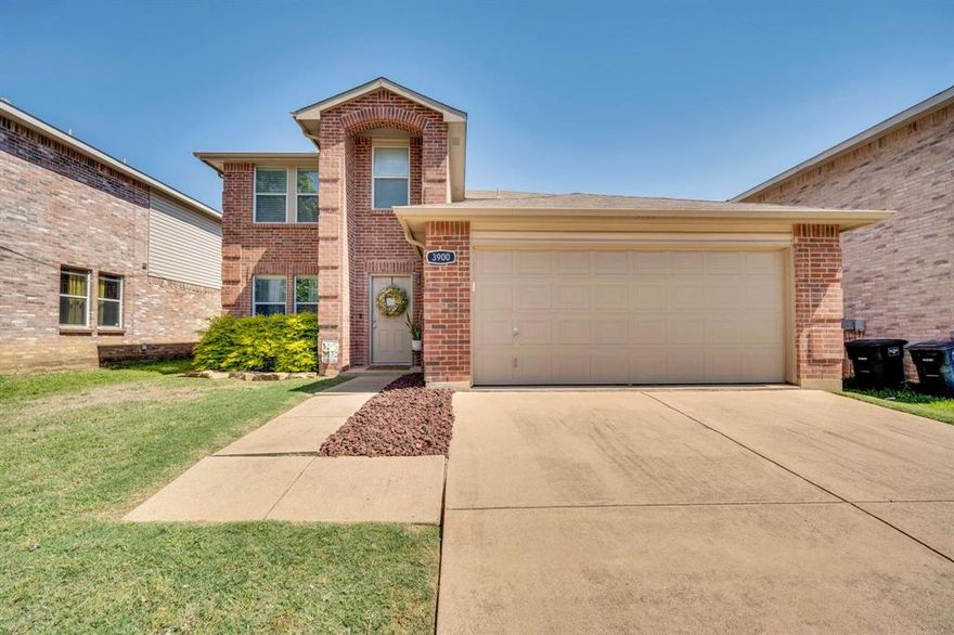 Beautifully maintained and full of charm, this two-story home at 3900 Country Lane in Fort Worth truly reflects the seller’s pride of ownership. Offering 4 bedrooms, 2.5 bathrooms, and an ideal layout for both everyday living and entertaining, this home combines comfort, space, and convenience in a fantastic location. The main floor features beautiful wood flooring throughout the living areas, a formal dining room, and a spacious family room centered around a cozy wood-burning fireplace. The kitchen offers an oversized peninsula with plenty of seating, an eat-in breakfast area, abundant cabinet space, and a large walk-in pantry perfect for storage and organization. The primary suite is conveniently located downstairs and offers a relaxing retreat with a garden tub, separate oversized shower, and an extra-large walk-in closet. The primary bedroom is carpeted for added comfort. Also located on the first floor are the spacious laundry room and a convenient half bath. Upstairs, you’ll find a large game room along with three oversized bedrooms featuring generous closet space and a full bathroom. The staircase showcases beautiful wood flooring, while the entire second floor is comfortably carpeted. Step outside to enjoy the beautifully landscaped front yard and an extra-large backyard complete with a wood privacy fence — perfect for entertaining, pets, or relaxing evenings outdoors. The home also includes a two-car garage. Located just off the Chisholm Trail Parkway, this home offers quick access to shopping, dining, I-35W, and is only minutes from Downtown Fort Worth.