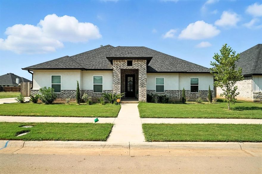 Welcome to this stunning 4-bedroom, 3-bath home located in the desirable Wylie ISD and only a couple of years old! With great curb appeal and a modern design, this home offers both comfort and style in a sought-after neighborhood.
Step inside to find a spacious and welcoming living room, featuring a cozy fireplace with custom built-in features — perfect for relaxing evenings or entertaining guests. The heart of the home is the beautifully designed kitchen, boasting a large eat-at island, crisp white cabinets, sleek white countertops, and a striking backsplash that ties it all together. Whether you're cooking for family or hosting friends, this space is made to impress.
The primary retreat is generously sized, offering a peaceful escape with its own luxurious ensuite bathroom. You'll love the oversized soaking tub, walk-in shower, dual vanities, and thoughtful layout designed for both function and relaxation.
The additional three bedrooms are all spacious, making them ideal for guest rooms, home offices, or whatever your lifestyle needs. With three full bathrooms, there’s plenty of room and convenience for everyone.
Step outside to a covered back patio that’s perfect for outdoor dining or simply enjoying a quiet evening. The large, grassy backyard offers ample space for play, pets, or future outdoor projects.
With its modern finishes, thoughtful layout, and prime location in a great school district, this home checks all the boxes. Don’t miss your opportunity to make it yours!