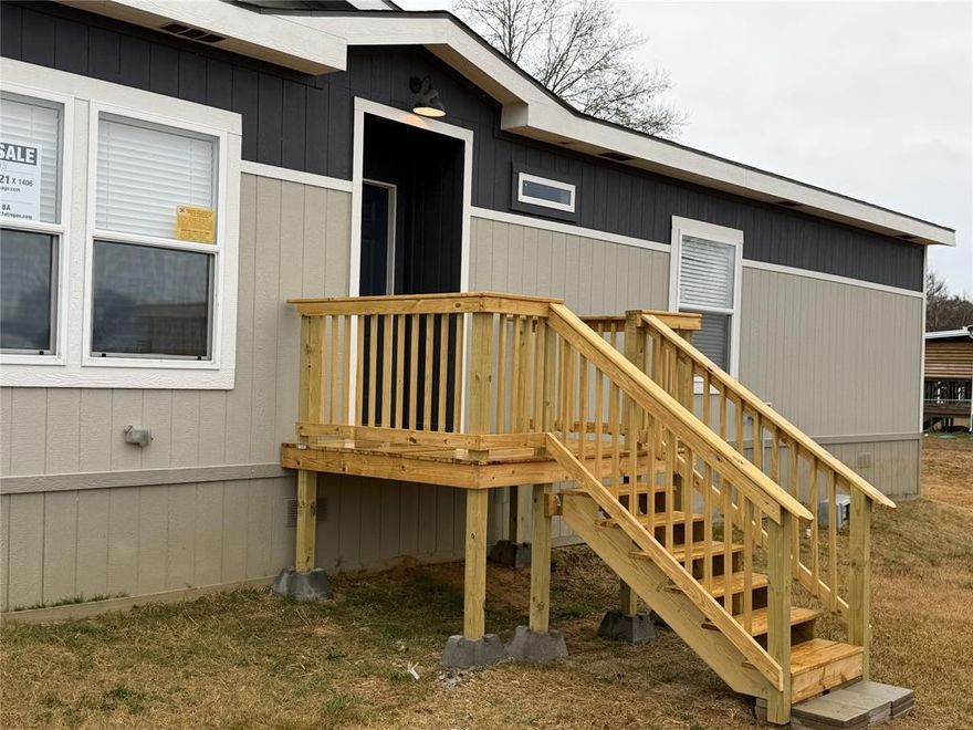 This SPACIOUS 2022 manufactured home is like new. Inside, you'll find a spacious open-concept layout, featuring a large living room, abundant natural light.  The kitchen flows seamlessly into the dining and living areas--perfect for family gatherings or entertaining. Also has a separate den for relaxing, watching tv and entertaining.  This 4 bedroom, 2 bath is move-in ready with large rooms & storage throughout. Large laundry room. Luxury wood look vinyl flooring throughout the home.  Discover your dream home in East Texas!