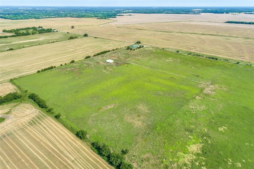 GREAT DEVELOPMENT OPPORTUNITY ON 25.76 ACRES.   Build your dream home or develop into smaller tracts.  Barn is included.  Property currently has ag exemption.  The house and 2 acres were previously sold.