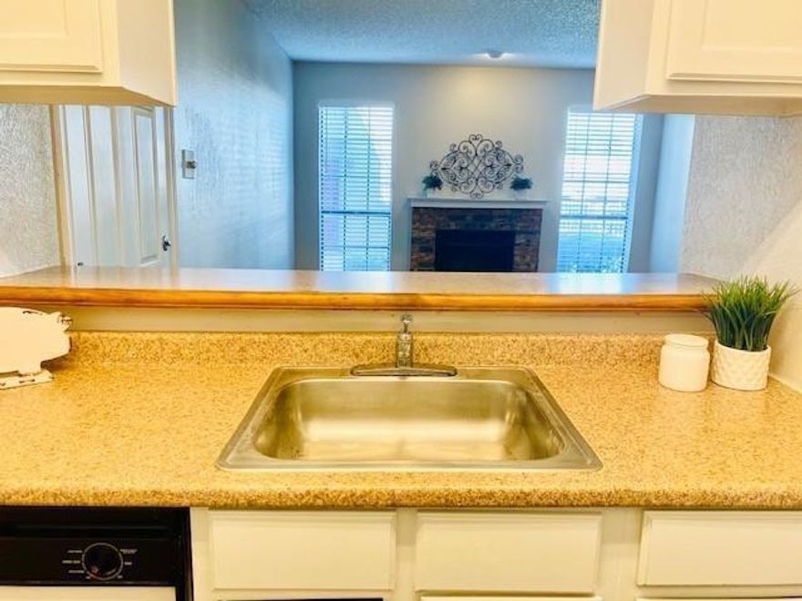 Discover the ultimate poolside retreat in the heart of North Dallas. This exceptional first-floor residence offers a rare blend of serene living and urban convenience, perfectly situated within the highly acclaimed Plano ISD. From the moment you enter, the open-concept layout impresses with sleek luxury vinyl plank flooring and a crisp, neutral palette that creates a bright and airy atmosphere. At the heart of the home, a classic brick wood-burning fireplace adds a touch of cozy character, ideal for relaxing on chilly Texas evenings. The oversized owner’s retreat is a true sanctuary, boasting a large walk-in closet and seamless access to the private patio. This outdoor space serves as your own private oasis, offering front-row views of the sparkling community pool and a convenient exterior storage closet. Strategically located for an effortless lifestyle, this home is just minutes from Central Market, the North Dallas tech corridor, and the University of Texas at Dallas. With assigned parking spot 108 and instant access to major freeways, high-end dining, and premier shopping, this move-in-ready condo is the perfect place to call home. Schedule your showing today to experience this rare find in person.