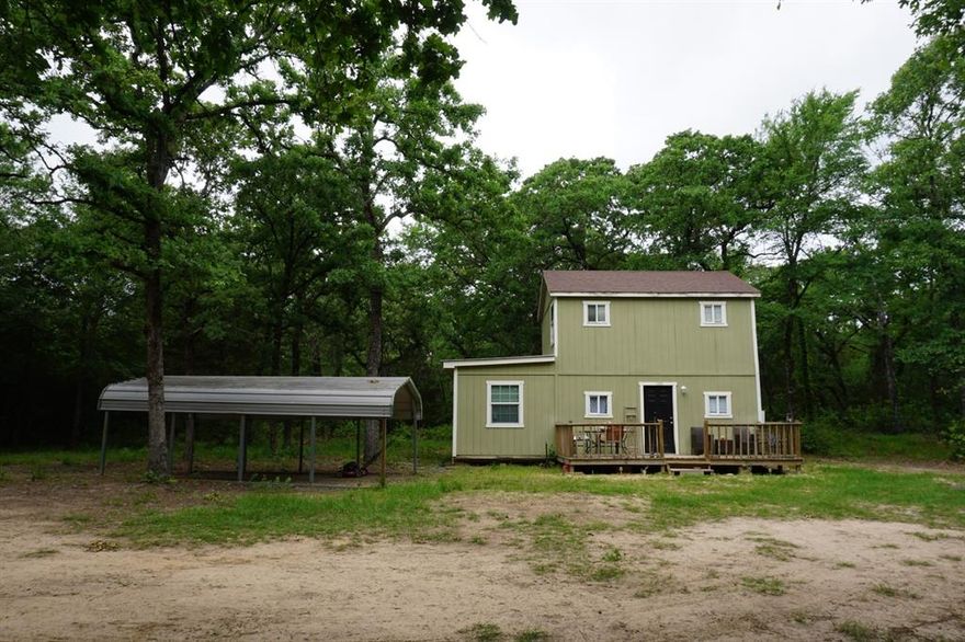 Cozy 1 bed 1 bath cabin in the woods! Sits on just under 2 acres of land in the country, and surrounded by towering oaks & hardwoods!! Perfect for those wanting a quiet and peaceful weekend retreat! Would also make ideal starter home, or great place for retiree downsizing and enjoying the less is more concept! Surrounded by other wooded acreage properties! Won't last long! In coveted CRISD! Great location! - only 2 miles from school, 10 minutes to town, and 2 of the largest lakes in Texas only 10 & 20 minutes away! OWNER FINANCING AVAILABLE!  HURRY!!