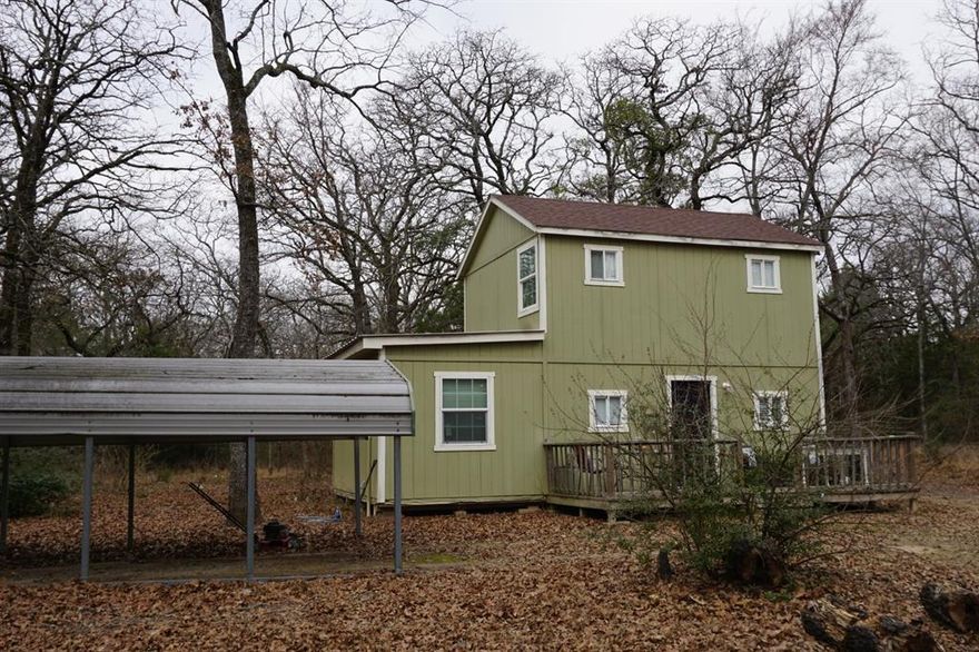 Cozy 1 bed 1 bath cabin in the woods! Sits on just under 2 acres of land in the country, and surrounded by towering oaks & hardwoods!! Perfect for those wanting a quiet and peaceful weekend retreat! Would also make ideal starter home, or great place for retiree downsizing and enjoying the less is more concept! Surrounded by other wooded acreage properties! Won't last long! In coveted CRISD! Only $149K! Great location! - only 2 miles from school, 10 minutes to town, and 2 of the largest lakes in Texas only 10 & 20 minutes away! OWNER FINANCING AVAILABLE!  HURRY!!
