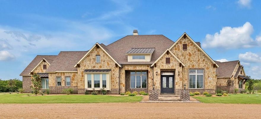 Seller is offering a $25,000 Credit to Buyer with acceptable offer to be used towards closing costs or interest rate buy down.  Rockwall County’s hidden gem—an exceptional custom estate in a gated community surrounded by conservation land. Set on a beautifully landscaped 1.5 acre lot, this home offers 4 spacious bedrooms each with walk-in closets, 3 living areas, and a private office that can serve as a 5th bedroom. Soaring ceilings, hand-textured walls, and elegant finishes throughout. The chef’s kitchen features professional grade Monogram appliances, including a 48 inch built-in fridge, 6-burner dual fuel range with double ovens, dual dishwashers, warming drawer, microwave drawer, and custom granite countertops.
The private primary suite includes crown molding, cove lighting, a decorative window seat, and a luxurious bath with dual vanities, makeup counter, soaking tub, and walk-in shower with dual shower heads. A wine room with handcrafted oak racks, wine refrigerator and ambient lighting adds sophistication. Outdoor living includes a full kitchen with a Blaze 40 inch grill, granite counters, sink, fridge, covered patio, and 600 sq ft of outdoor entertaining space.
Engineered for efficiency: Tella Firma foundation (63 piers), R-60 attic insulation, poly-sealed windows and doors, Owens Corning roof with radiant barrier, ZIP board structural panels, and 500-gal buried propane tank. Extras: 1,000 sq ft 3 car garage, dual driveways, full sprinkler system, termite-treated framing, and septic.  Located in a peaceful setting yet close to local amenities, this luxury estate offers the perfect combination of privacy, elegance, and convenience.