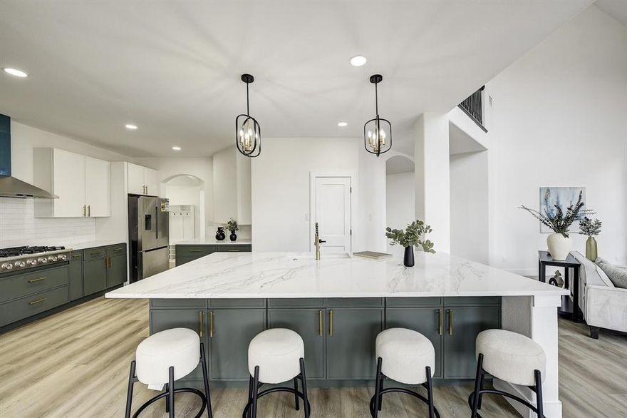 Embrace refined living in the highly sought-after community of Bellegrove. From the moment you step inside, soaring ceilings and gray wood-look luxury vinyl floors set the tone with modern sophistication and timeless elegance. A private office with French doors, a formal dining room framed by dramatic bay windows, and an additional family room near the entry provide both function and style, all tied together by a breathtaking two-story chandelier above the loft.

The heart of the home is the open-concept kitchen and living room, where towering windows flood the space with natural light and showcase a gorgeous view of the backyard. A striking fireplace serves as the focal point, perfect for cozy gatherings. The chef’s kitchen is designed to impress, featuring a massive marble island, designer lighting, six-burner cooktop, double ovens, premium appliances, a walk-in pantry, seamless access to the dining room, and an inviting eat-in breakfast nook for everyday dining.

The luxurious primary suite is generously sized—offering room for a private seating area or office—while the spa-like bathroom retreat wows with a freestanding tub, walk-in shower, and dual walk-in closets.

Ascend the curved staircase to discover an oversized game room, media room, wet bar, and four spacious secondary bedrooms—ideal for both entertaining and everyday living.

Step outside to your own backyard oasis, complete with an extended patio, sparkling pool,  flowerbeds, and additional green space along the side yard. A three-car tandem garage with driveway access completes this perfect home.

All just minutes from Celebration Park, premier shopping, and dining.