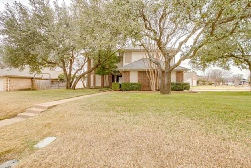 Exceptional drive-up curb appeal welcomes you to this beautifully updated corner-lot home, framed by mature trees. Step through the custom front door into a warm, inviting entry that immediately feels like home. A private home office near the front of the house features a charming bay window and abundant natural light.

The living room offers a comfortable atmosphere highlighted by an updated wood-burning fireplace and opens seamlessly to the breakfast area and kitchen. The tastefully updated kitchen features an island, ample cabinetry, and generous storage. A spacious dining room is perfect for gatherings with family and friends. A convenient half bath is located on the main level for guests.

Upstairs, the primary suite includes a tub, separate shower, and a large walk-in closet. Two additional generously sized bedrooms also offer walk-in closets. A versatile upstairs playroom can easily function as a fourth bedroom.

Additional highlights include a 598 sq ft side-entry garage and a backyard large enough to accommodate a pool and play area. This move-in-ready home truly has it all.