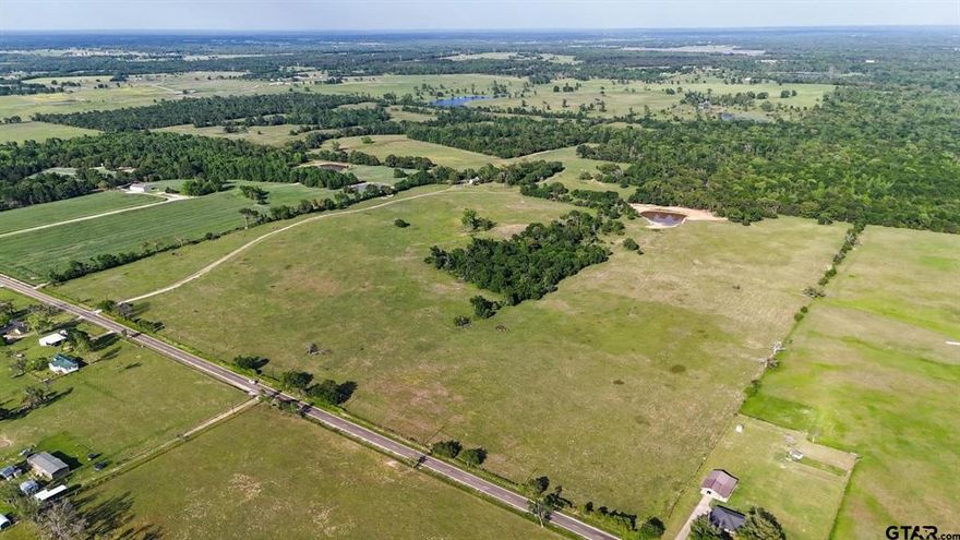 Land lots of Land! This is your chance to own 295 acres of prime East Texas land in the Ben Wheeler area, located within the outstanding Martin’s Mill School District. The property offers a fantastic combination of hardwood timber and approximately200 acres of improved coastal pasture, perfect for hay production, livestock, or recreation. A picturesque pond provides a peaceful setting and a water source for livestock or wildlife. A comfortable 3 bedroom, 2 bath home, ideal as a primary residence, weekend retreat, or ranch headquarters Four strand barbed wire fencing around the property A well on site, County road frontage for easy access. This is a turn key property with everything you need for ranching, recreation, or investment. The mix of open land and wooded areas offers privacy, productivity, and potential in one exceptional package.