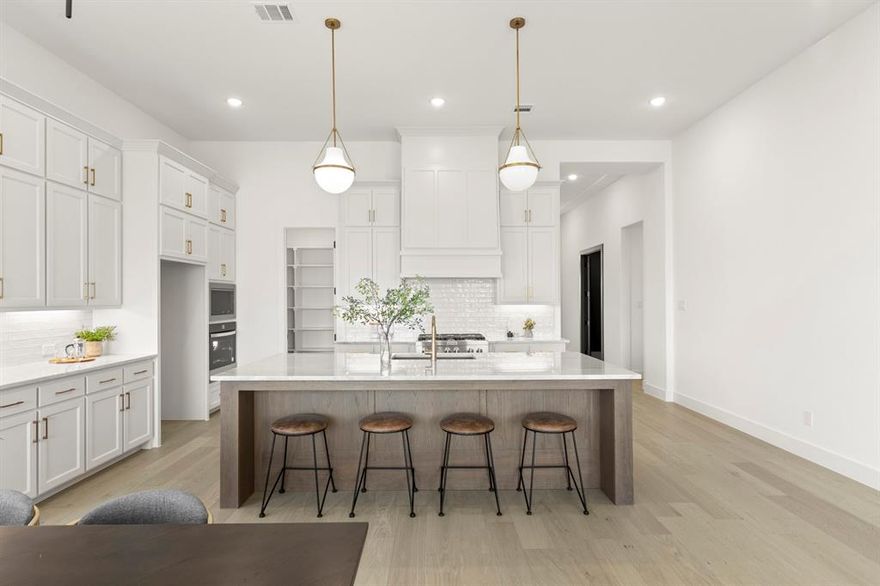 MLS# 21163337 - Built by Tradition Homes - Ready Now! ~ This beautiful one-story home offers the perfect balance of luxury and convenience. The open-concept layout seamlessly connects the living, dining, and kitchen areas, making it ideal for entertaining. A dedicated study offers a quiet space for work, while the media room provides a cozy retreat for movie nights. The owner’s suite features a free-standing tub, separate vanities and a spacious walk-in closet that leads to the laundry room.