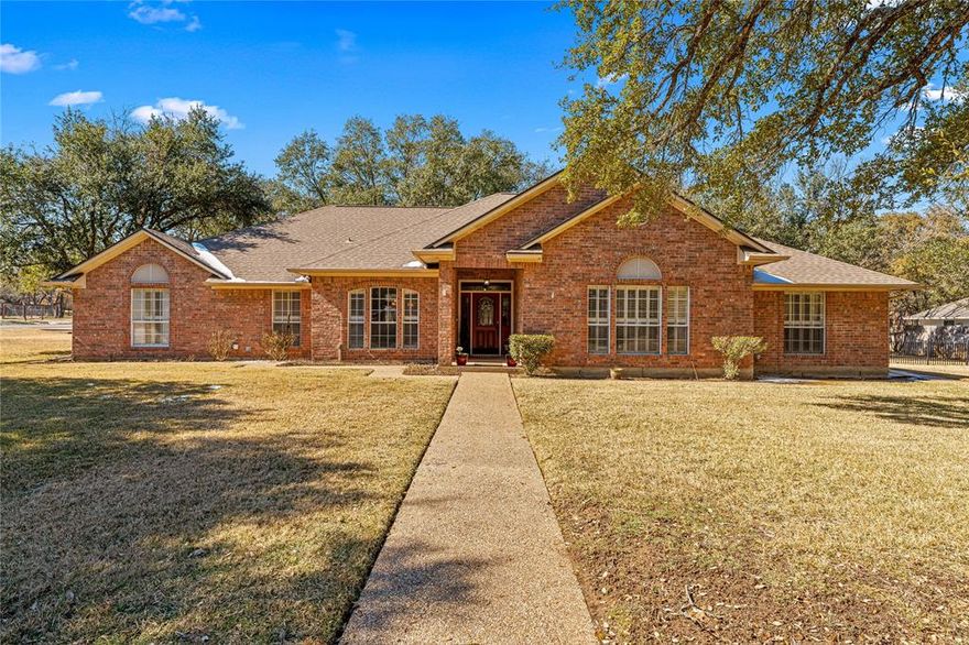 Stunning, well-maintained brick home on a gorgeous corner lot in the desirable China Spring ISD. This spacious 4-bed, 3-bath one-story offers 2,816 sq. ft. of thoughtful living space on over 1 acre with mature live oak and hardwood trees providing shade and privacy. The open, functional floorplan flows seamlessly for everyday living and entertaining. Recent upgrades include fresh interior paint and a remodeled primary bath. Enjoy a fully fenced backyard, covered patio, and a storage shed for extra space. Beautiful landscaping enhances the peaceful setting in a quiet neighborhood with quick access to Waco and Hwy 6. Rear-entry 2-car garage completes this well-appointed property. New garage door installed in 2026 with cell phone operation. Don’t miss out on this exceptional home!
