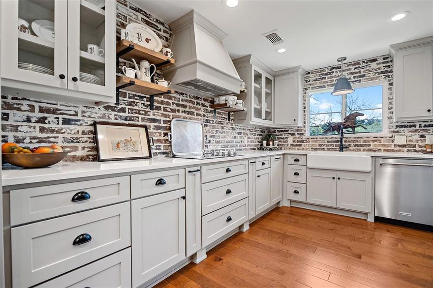 Peaceful country living meets modern comfort in this beautifully updated home, tucked away on a quiet cul-de-sac surrounded by horse properties in Argyle ISD. Step inside to find rich hardwood floors, quartz countertops, and a fully renovated kitchen (2020) featuring custom cabinetry, upgraded appliances, and sleek finishes. With two spacious living areas and a dedicated office, there’s room for both work and play. The large primary suite is a true retreat, offering a walk-in closet, a stunning spa-like bath, and even its own laundry area for ultimate convenience. Step in from the three-car garage to a custom mudroom, thoughtfully added by the sellers to provide extra storage and keep everything organized. Bring your horses—this property is ready with a 4-stall barn (electric + water), steel pipe fencing, and a picturesque pond. All the charm of country living, yet just minutes from shopping, dining, and everyday conveniences and 20 minutes to Lake Lewisville. Argyle offers a charming, friendly small-town community that still offers the vibrancy of a big city nearby.