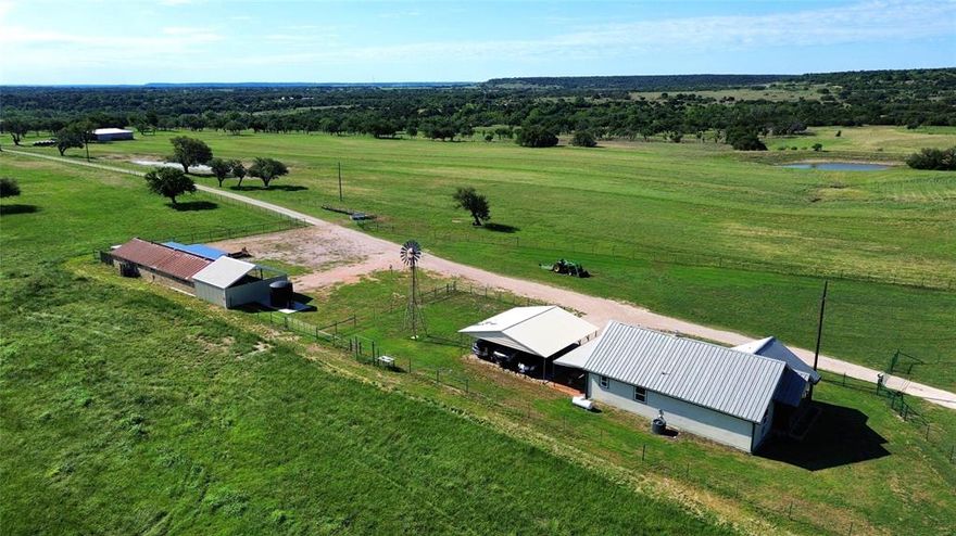 Discover an exceptional Texas Hill Country Ranch located 1.5 hours from Ft. Worth and Austin! The Ranch boasts High-Speed Fiber Optic Internet, Multi-County Water, and a 2025 installed water well, ensuring modern convenience in a serene setting. The land has been expertly cleared of mesquite and cedar, seeded with native grasses, creating lush rolling pastures. With Three large stock tanks, fully fenced and cross-fenced into four distinct pastures, the ranch is ideal for livestock or agricultural pursuits. True hunters-paradise with abundant wildlife! 
The property features significant improvements, including a beautifully remodeled 2 bed and 2 bath Farmhouse, and a stylish Texas-Inspired 2 bed and 2 bath Rock Barndominium with contemporary amenities, a spacious 40x60 metal shop, and a well-equipped campsite with two RV pads and full hookups. With over 4,000 feet of prime road frontage along HWY 281 and CR 520, this ranch offers endless possibilities—whether for development, cattle operations, short-term rental ventures, or a tranquil retreat from urban life. Embrace the opportunity to own a Turnkey Hill Country Gem, ready for your vision!
