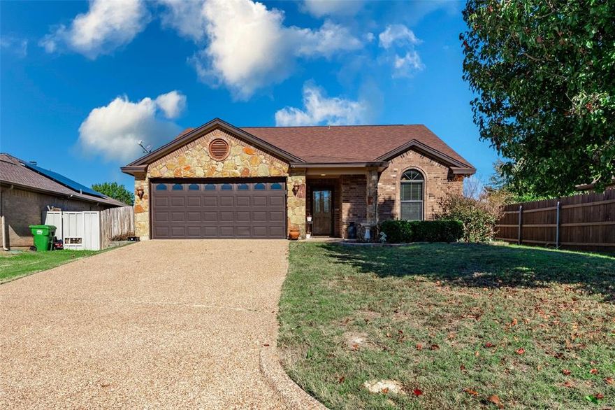 CHARMING 3 BEDROOM 2 BATH HOME IN SPRINGTOWN, TEXAS!! This home offers an inviting space ideal for comfort! The kitchen boasts stainless steel appliances, dual sinks, and a convenient breakfast bar that flows seamlessly into a cozy breakfast nook featuring beautiful bay windows. The abundant natural light in the large living room complements the decorative fireplace. The primary bedroom is a retreat, complete with a walk-in closet and an ensuite bath that includes extra linen cabinets for added storage convenience. Outside, the property features a spacious private backyard perfect for outdoor activities, along with a convenient storage shed. Plus, two sides of the backyard fence will be repaired, ensuring both privacy and security. With a gorgeous brick and stone exterior, this home offers comfort and functionality. Home sits in a perfect location with access to local shopping and dining, you will love this vibrant community of Springtown, Texas!! DON'T WAIT, THIS HOME IS A MUST SEE!!!