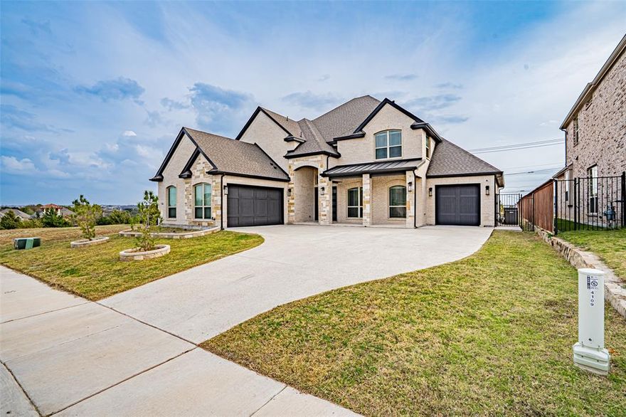 Welcome to this stunning practically new home in the highly sought-after La Frontera community. With over 4,000 square feet of thoughtfully designed living space this residence perfectly balances elegance, comfort, and functionality ideal for everyday living and effortless entertaining.
The kitchen serves as the heart of the home showcasing modern design, an open layout, and seamless flow to the breakfast nook and spacious living room with a cozy fireplace. Host memorable gatherings in the formal dining room or stay productive in the private office. The main-floor primary suite offers a tranquil retreat complete with an en-suite bathroom featuring dual sinks, a jacuzzi tub, a separate shower, and a generous walk-in closet. Upstairs the possibilities are endless with an expansive game room along with a dedicated media room featuring a built-in wet bar. The Texas-sized bedrooms upstairs all include walk-in closets and two of them share a convenient Jack-and-Jill bathroom with separate dual sink areas. Step outside to the covered patio and fully fenced backyard an ideal setting for relaxing summer evenings. Located just moments from Eagle Mountain Lake you’ll enjoy convenient access to boating, fishing, swimming and countless outdoor adventures. La Frontera offers exceptional amenities including walking trails, picnic areas, parks, and a splash pad. Plus, the home’s prime location provides easy access to major highways, shopping, dining, and top-rated schools. This home offers the perfect blend of luxury and practicality and includes numerous upgrades such as stainless steel appliances, luxury tile and carpet, upgraded kitchen cabinetry and countertops, a jacuzzi tub in the primary bath, built-in surround sound, 2-inch faux blinds throughout, a grand two-story entry with iron stair railing, double front doors, a partial circular driveway, a fully built-out media room, and so much more. Hardly lived in and meticulously maintained this exceptional home is move in ready!