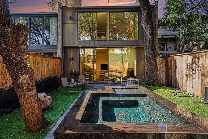 Beautifully updated Frank Welch townhome, on the beautiful, highly sought after, Buena Vista Street, in Uptown Dallas. When you walk in, you are greeted by a beautiful foyer, that leads you into the warm and modern living room, with an abundance of natural light. Living room has beautiful views of the private, well curated back yard, with a beautiful in ground jetted and heated spa. The kitchen boast an spacious island, that houses the gas stove, and a built in refrigerator. Once you head up stairs, you will see the very spacious guest bedroom, and the spacious primary bedroom, with a fireplace and a sitting area. Both rooms have floor to ceiling glass doors, that invite in an abundance of natural light. The two car attached garage, has an plug ready for your electric vehicle. This home is located near a Katy trail entrance, and near plenty of restaurants and shopping. Near West Village shopping center, Knox Henderson, and everything else that Uptown Dallas has to offer.