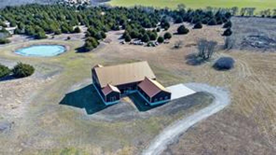Welcome to Country Living with City Connections!  This custom home sits on 52 acres between Farmersville and Josephine minutes away from I30, Hwy 380 and Hwy 78. Main suite and mother-in-law suite downstairs, 2 bedrooms upstairs each with an ensuite. A perfect entertainer’s home, 28 ft. ceilings, hardwood floors, chef’s kitchen, 2 sinks, 2 dishwashers, 2 ovens, commercial size refrigerator, quartzite countertops, and walk in pantry with built ins. Bonus room, oversized utility, mud room, wine room. Two enormous back porches.   Barn has 3 stables, with electricity, cold room, tack room, wash rack, and living quarters perfect for guests, or rental income.  Willing to subdivide.
