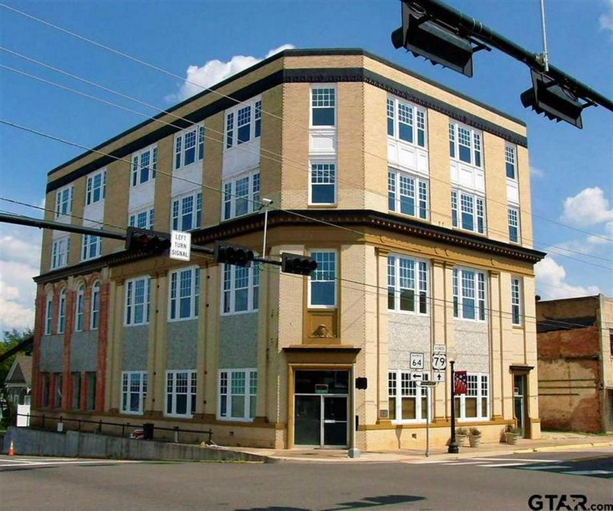 Large historic building needing full restoration. Four stories, plus penthouse, built in 1902. Approx. 18,000 sf; 0.279  ac. Greatproperty for bank, retail, restaurant, office suites or apartments. Brick veneer, concrete slab, new roof. Some exterior updates. Interiorwill need to be completely renovated. Was the first building built in downtown DT Henderson, Texas as the First National Bank. Nowtallest building. Great opportunity for renovation in historic downtown area. Street parking; area in the rear of property can be developedfor off-street parking. Located at SE corner of the Downtown Square Easy access to courthouse, Central Business District, East MainSt. (Bus. 79) & South Marshall St. ( Hwy. 64)