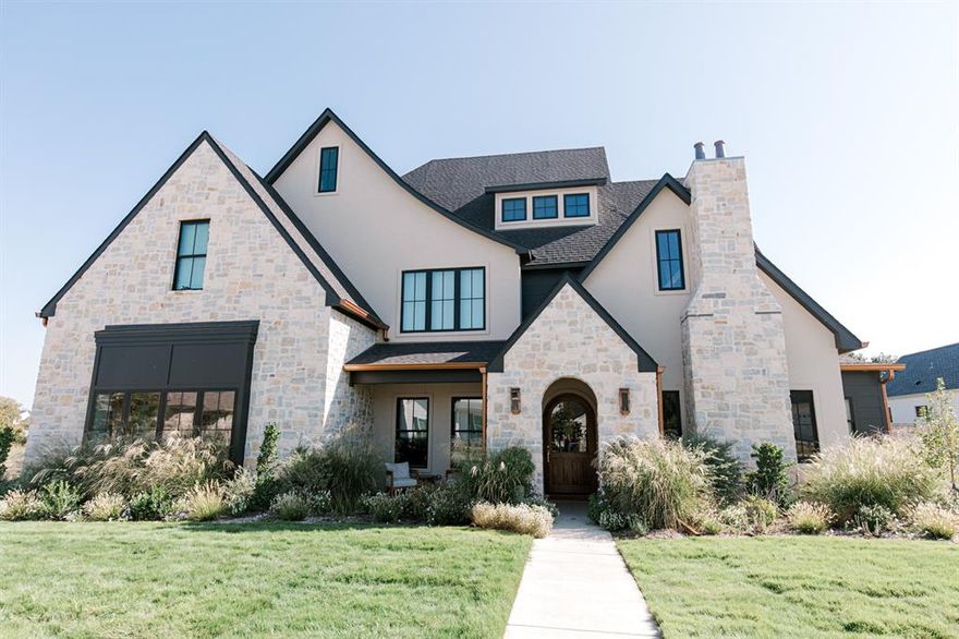 A thoughtfully designed custom home built by Whyte Oak Homes that blends timeless architecture with modern functionality, creating a space built for connection, comfort, and everyday living.
Nestled in the heart of Badger Ranch, this Modern Tudor-style residence was crafted to serve a growing, active family while showcasing the design-build capabilities of Whyte Oak Homes. With 5 bedrooms and 4.5 baths, the home balances spaciousness with purpose, offering both private retreats and inviting gathering spaces.
From the moment you arrive, the home makes a statement. A custom arched entry door sets the tone for the architectural character carried throughout, where soft curves, rich materials, and curated finishes create a warm, elevated aesthetic. Inside, natural light and intentional sightlines enhance the flow between spaces, making the home feel both open and grounded.
The heart of the home is designed for connection, anchored by a chef’s kitchen with double islands, premium appliances, and seamless access to indoor and outdoor living. A 12-foot pocketing slider opens to a vaulted back patio complete with an outdoor kitchen, extending the living space and making it ideal for entertaining or everyday family life.
The primary suite is a private sanctuary, featuring vaulted ceilings, a fireplace, and a spa-inspired bathroom with a soaking tub and oversized shower. A custom-designed closet connects directly to the laundry room, blending luxury with practical design.
Throughout the home, millwork, 4 fireplaces, and carefully selected materials reflect a luxury craftsmanship and detail. Additional features include a butler’s pantry, media room with surround sound, and thoughtfully designed secondary spaces such as a study or library.
Every detail reflects a balance of beauty, durability, and function, aligning with Whyte Oak Homes philosophy of building homes that are not only visually compelling but designed to stand the test of time.
Seller is licensed realtor