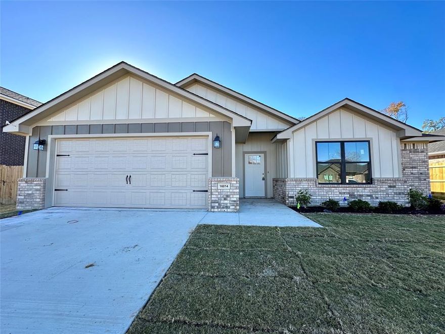 Welcome to your dream home in the heart of the charming and vibrant Crossings Subdivision. This brand-new 3-bedroom, 2-bath residence is a testament to modern comfort and stylish living. Enjoy the meticulously designed sidewalks, well-defined curbs, and concrete roads, creating a welcoming environment for both residents and guests. The kitchen is a true showstopper with its chic weathered oak stained upper cabinets paired with bold black lower cabinets and a central island. This stunning combination adds a touch of contemporary elegance to the heart of the home while also offering ample counter space for meal preparation and entertaining. In the living area, a beautiful black brick fireplace becomes the focal point, creating a cozy ambiance for gatherings with family and friends.