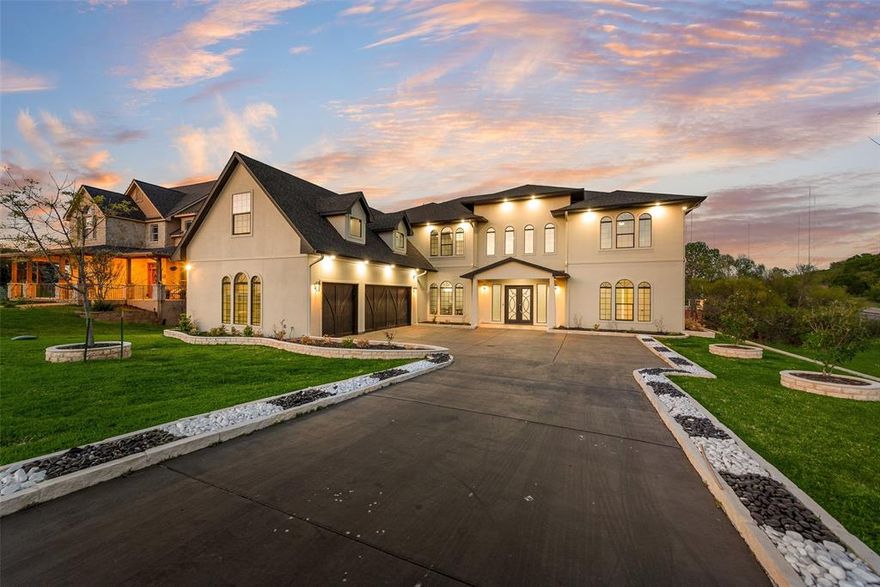 Welcome to 464 Breezeway Court! Under 30 minutes from downtown Dallas, the serene Lake Ridge community is a true retreat, nestled within the winding roads and beautiful limestone hills of Cedar Hill. After being greeting by a grand double staircase, you'll instantly notice stunning water views beyond your triple French door living room wall. Over $50K in recent upgrades have elevated both style and function. A true chef’s kitchen features a 6-burner gas cooktop, hibachi-style grill, double ovens, built-in commercial-grade refrigerator, and double islands that offer exceptional prep space and gathering areas. The primary suite is a standout, complete with 2 massive walk-in closets, one offering 3-tier storage and custom lighting for a boutique-style experience. The office is connected to the primary bedroom through a 31-foot balcony overlooking the water. The gym also captures this stunning view with 6 large windows. Thoughtfully updated and designed for both entertaining and comfort, this home blends high-end features with one of Cedar Hill’s most sought-after natural settings. This location is an outdoorsman's dream. Just minutes from Cedar Hill State Park and Joe Pool Lake, enjoy boating, fishing, and lakeside recreation, along with miles of hiking and biking trails. Nearby Cedar Ridge Preserve offers over 600 acres of preserved land with scenic overlooks and miles of wooded trails with over 700 ft of elevation change. With extensive green space and a strong focus on outdoor living, Cedar Hill delivers a rare blend of nature and convenience just south of Dallas.