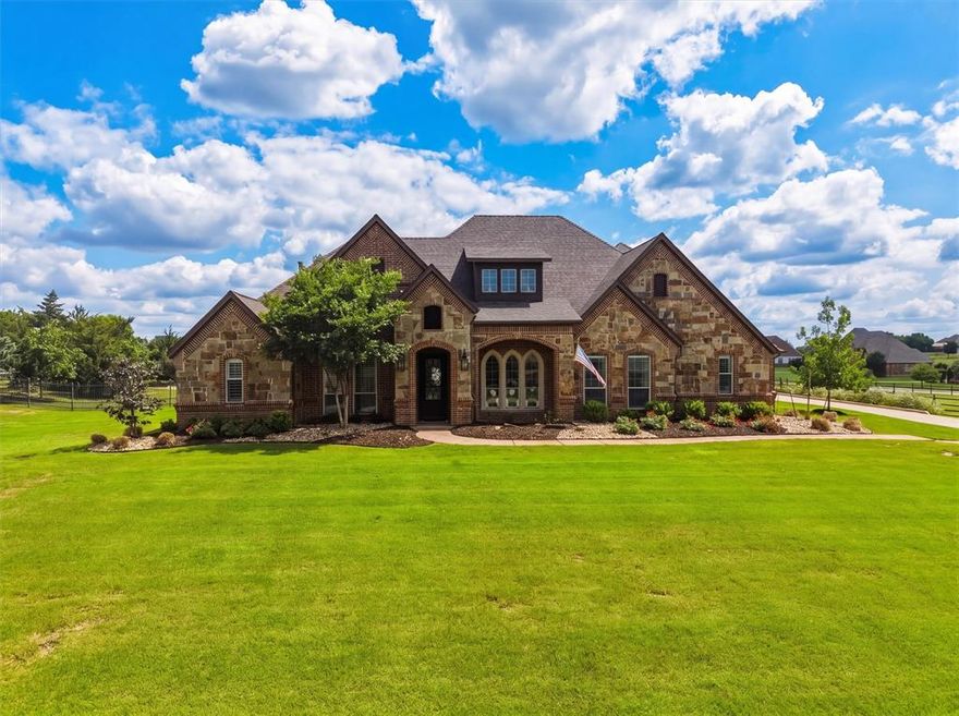 Renovated and updated stunning luxury home in the highly sought after Vista Ranch community. Over 3600sf, inground pool and spa, outdoor kitchen and bar, media room, 4Bed.4Bath.1.38 Acres, No water bill. The interior boosts the wow factor on every inch of this home. From the moment you enter, you'll notice the extensive upgrades, modern finishes, vaulted ceilings, decorative lighting, and open concept throughout. The gourmet kitchen features upscale countertops, gas cooktop, double ovens, built in appliances, oversized island eating area, butler's pantry, and abundant cabinetry. Spacious living area with striking stone fireplace overlooks the resort style backyard oasis. Step outside to your private retreat complete with a salt water pool and water features, outdoor kitchen and bar, built in grill, outdoor fireplace, covered patio, and expansive living area perfect for entertaining year round. Need a vacation, step outside into your backyard every day. Additional upgrades include a class 4 hail resistant roof, whole home water filtration system with reverse osmosis, generator, updated hvac systems, pool renovations.This meticulously maintained property also offers a 3 car garage, beautifully landscaped grounds, vacation like atmosphere. Located within NWISD near shopping, grocery stores like Kroger, restaurants and dining closeby, and major highways while still offering privacy and tranquility of acreage living.