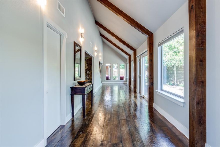 Urban custom-redesigned home truly stands out. It beautifully blends modern and rustic finishes, offering a unique living experience. This home is designed for both functional living and lavish entertaining. As you enter, you're greeted by an art gallery-style entrance that leads to a private outdoor oasis with a sparkling pool. The kitchen is a chef's dream, featuring a commercial 6-burner gas cooktop, ample cabinet space, and an oversized island with Carrera marble, all with views of the living area and outdoors. Plus, there's a convenient coffee bar in the breakfast nook. For flexible living arrangements or exceptional guest accommodations, there's a primary bedroom on each level. The first floor also includes a private third bedroom with an ensuite bath, tucked away behind the kitchen, which could easily serve as an office. Additionally, a versatile flex space at the entrance is perfect for an art exhibit, study, or play area. Upstairs, you'll find even more space to spread out in the large living area. Beyond its impressive design, this home boasts a fantastic location, incredibly close to Love Field, UT Southwestern, Parkland, and Children's Medical Center, with plenty of shopping and dining options nearby.